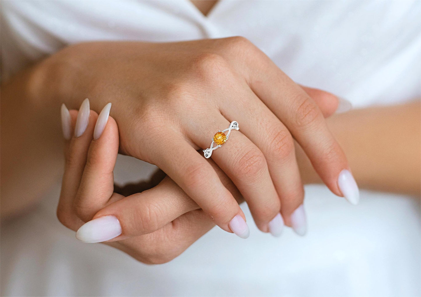 Neha Infinity: Infinity Ring with Orange Round Cut Stone