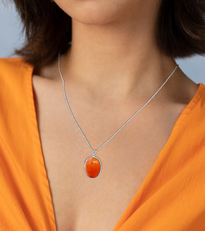 Kumudika Glow: Silver Pendant with Orange Semi-Precious Stone