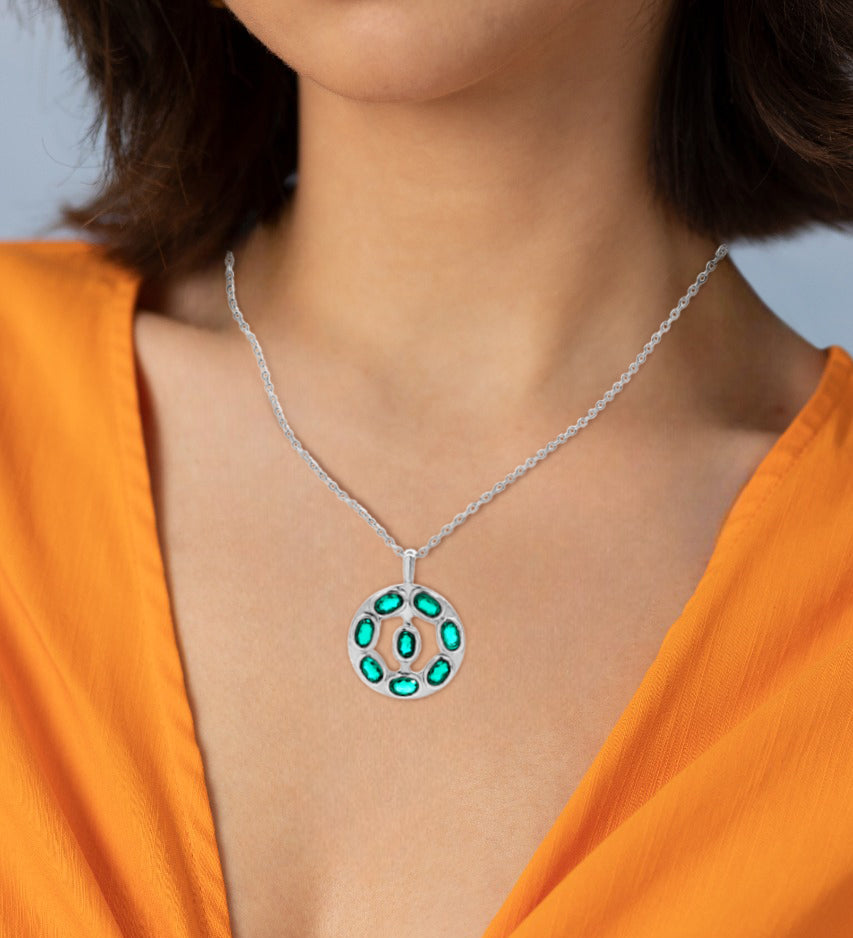 Saanvi's Emerald Orbit: Sterling Silver Coin Pendant