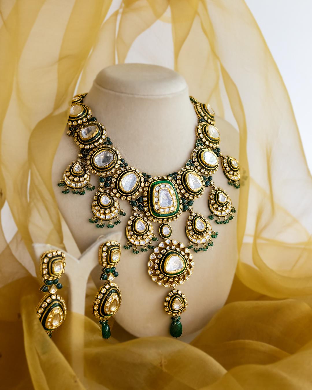 Rajsi Shobha: 18K Yellow Gold Intricate Polki Emerald Jewelry Set
